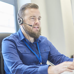 A man in a call using a headset
