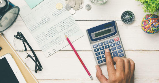 Glasses, pencil and calculator